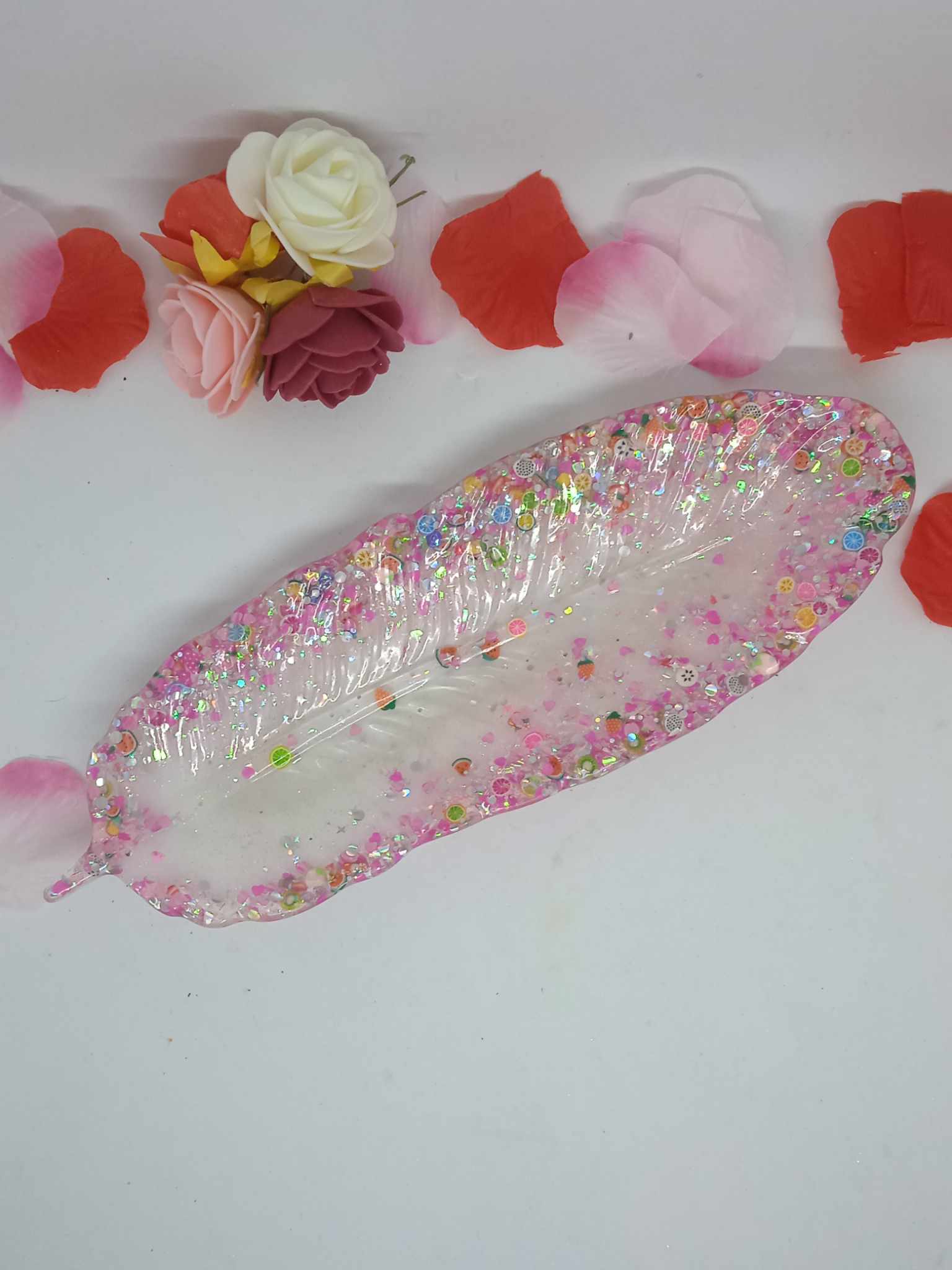 vide poche plume paillette